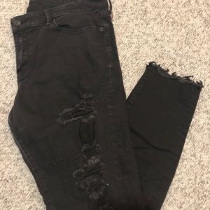 Distressed low rise black skinny jeans